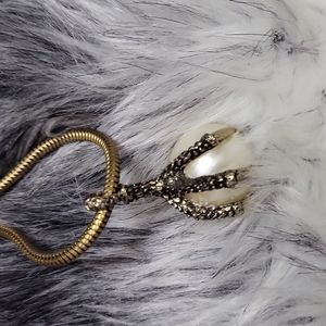 Claw on pearl necklace